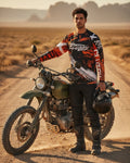 Man standing next to a motorcycle in a desert setting